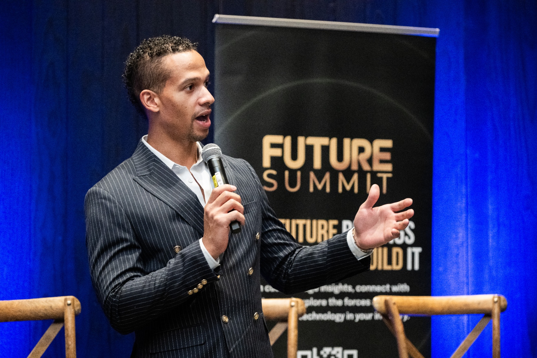 Josh Rainbow speaking at a Future Summit event